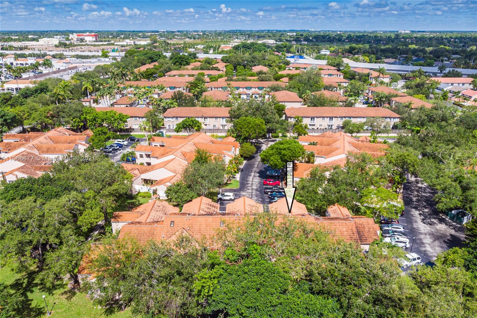 11820 Southwest 80th Street, Unit 312 Miami, FL 33183 - Photo 40 of 43 an aerial view of residential houses with outdoor space and trees