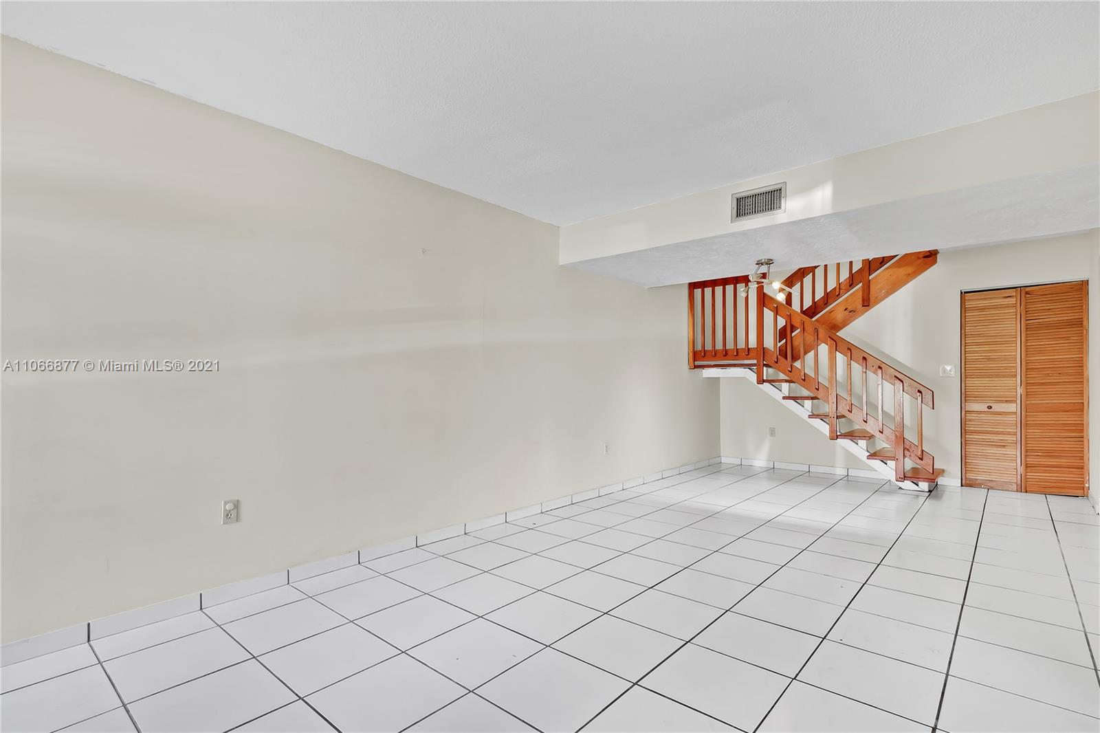11820 Southwest 80th Street, Unit 312 Miami, FL 33183 - Photo 5 of 43 a view of an entryway with stairs