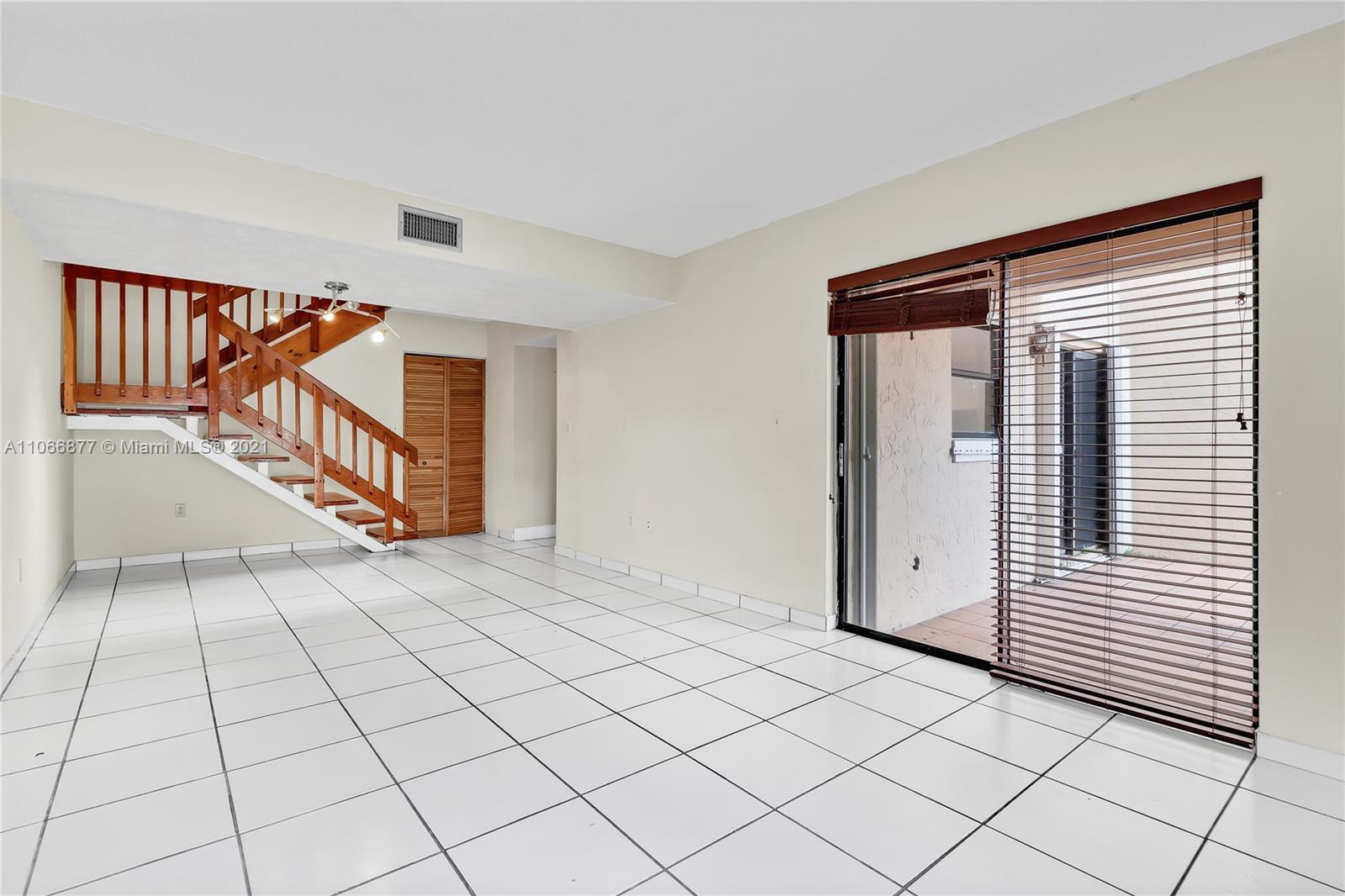 11820 Southwest 80th Street, Unit 312 Miami, FL 33183 - Photo 8 of 43 a view of an entryway with wooden floor