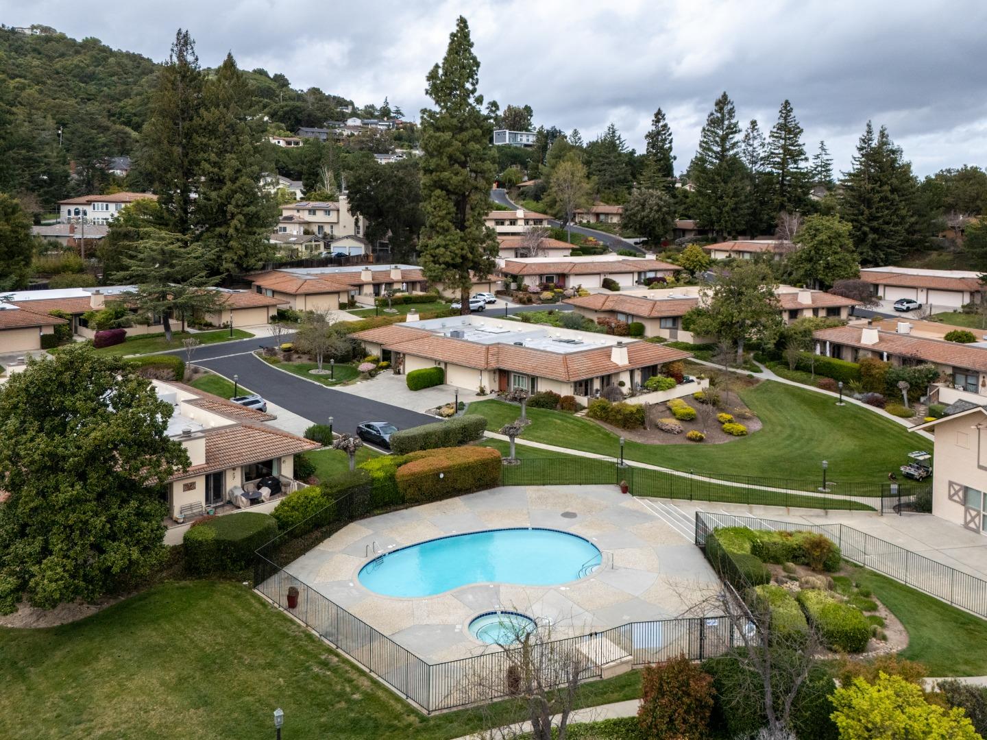 22415 Rancho Deep Cliff Drive Cupertino, CA 95014 - Photo 32 of 33 an aerial view of a swimming pool with a yard and outdoor seating