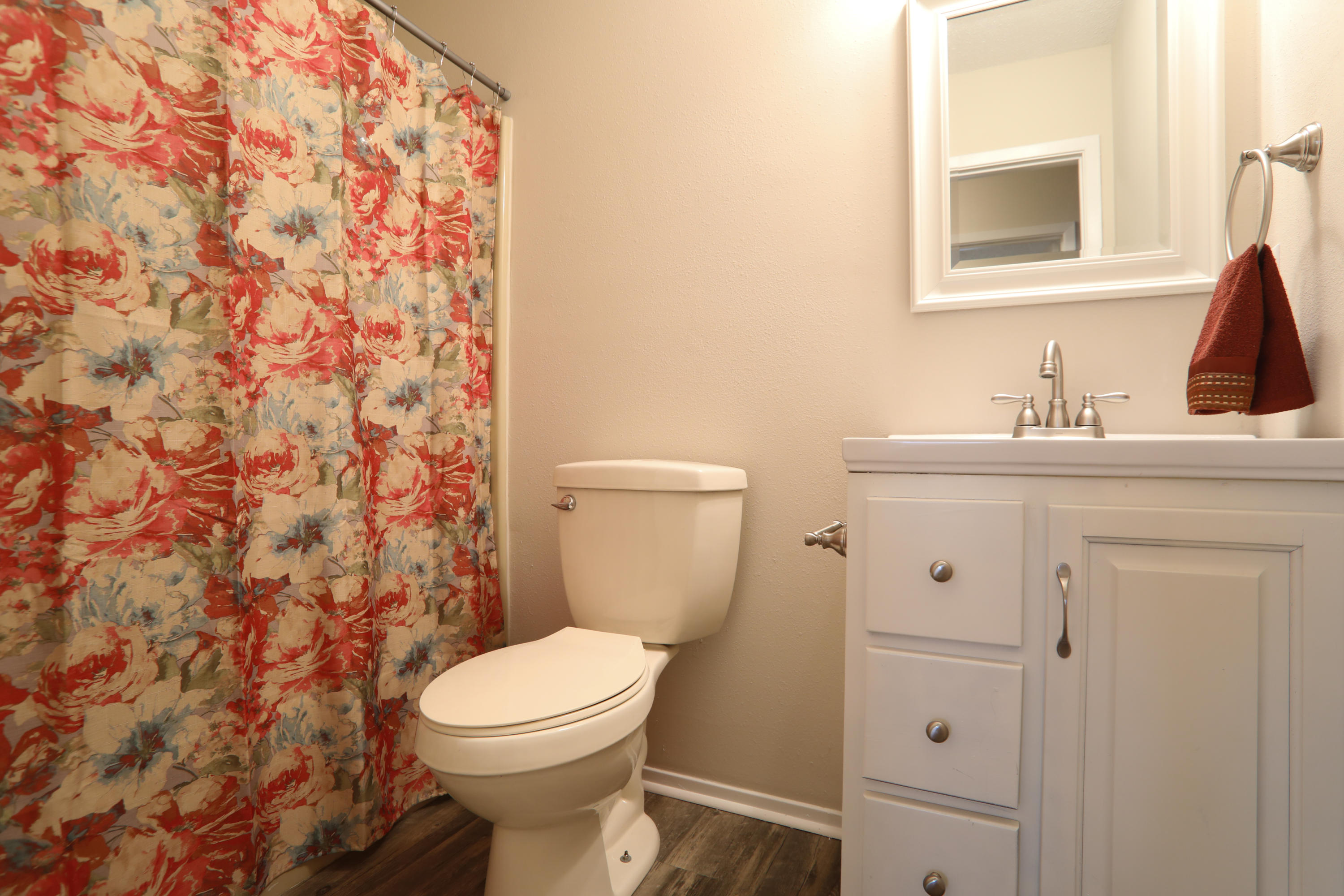 3387 Auburn Road Crestview, FL 32539 - Photo 8 of 19 a bathroom with a sink a toilet and a mirror