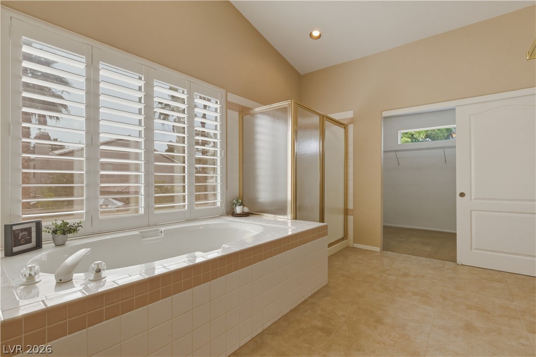 29 Olive Tree Henderson, NV 89074 - Photo 34 of 60 This spacious bathroom offers a relaxing soaking tub and a convenient shower.