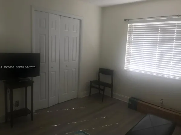 a kitchen with a sink and a refrigerator