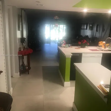 a bedroom with a bed and chair