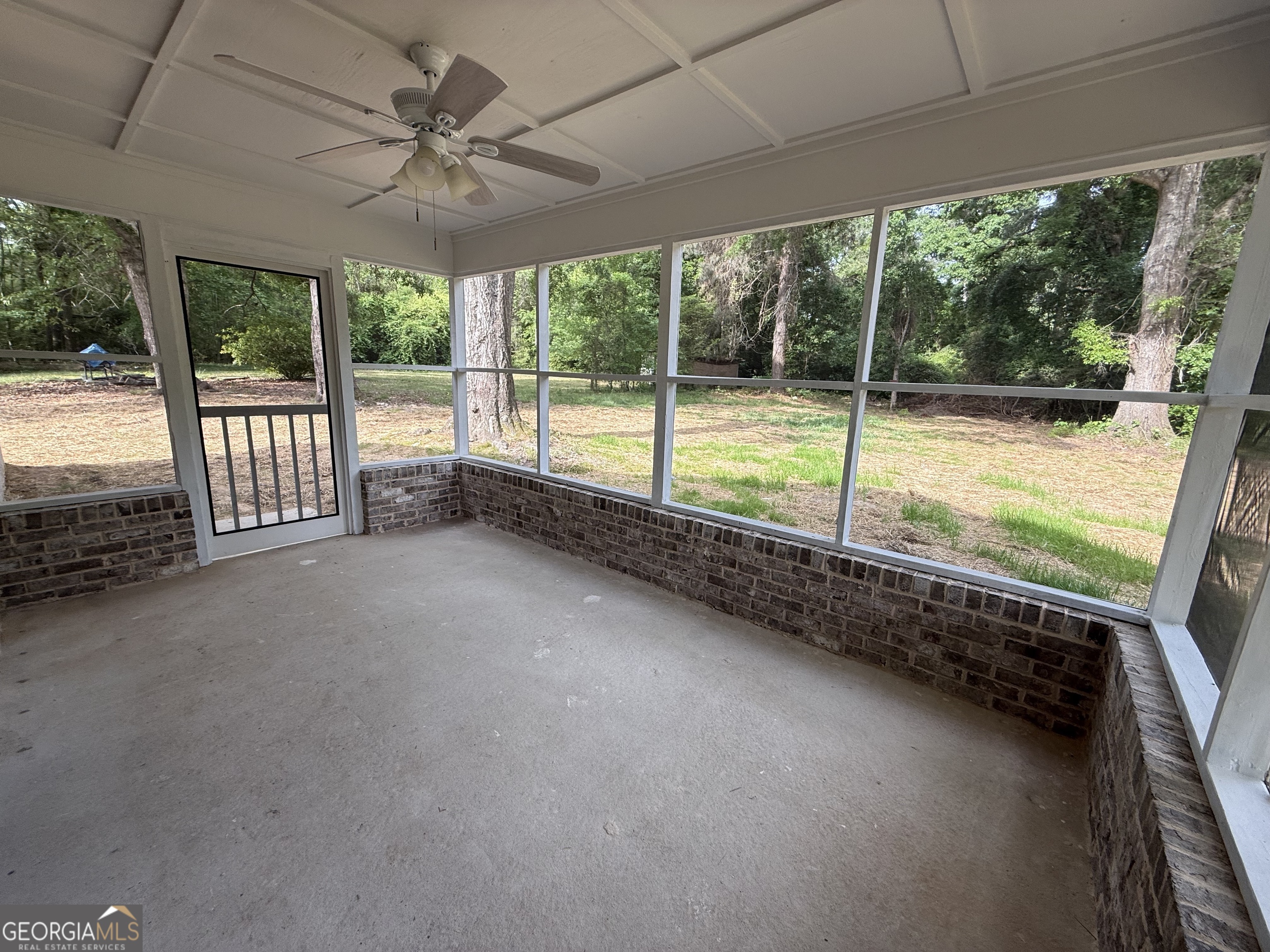 240 Sims Street Barnesville, GA 30204 - Photo 23 of 25 a view of an empty room with a large window