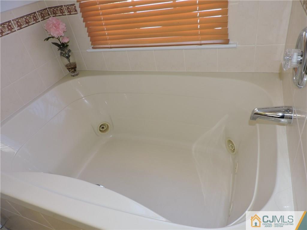 236 Hawthorne Road North Brunswick, NJ 08902 - Photo 14 of 25 a bathroom with a bathtub