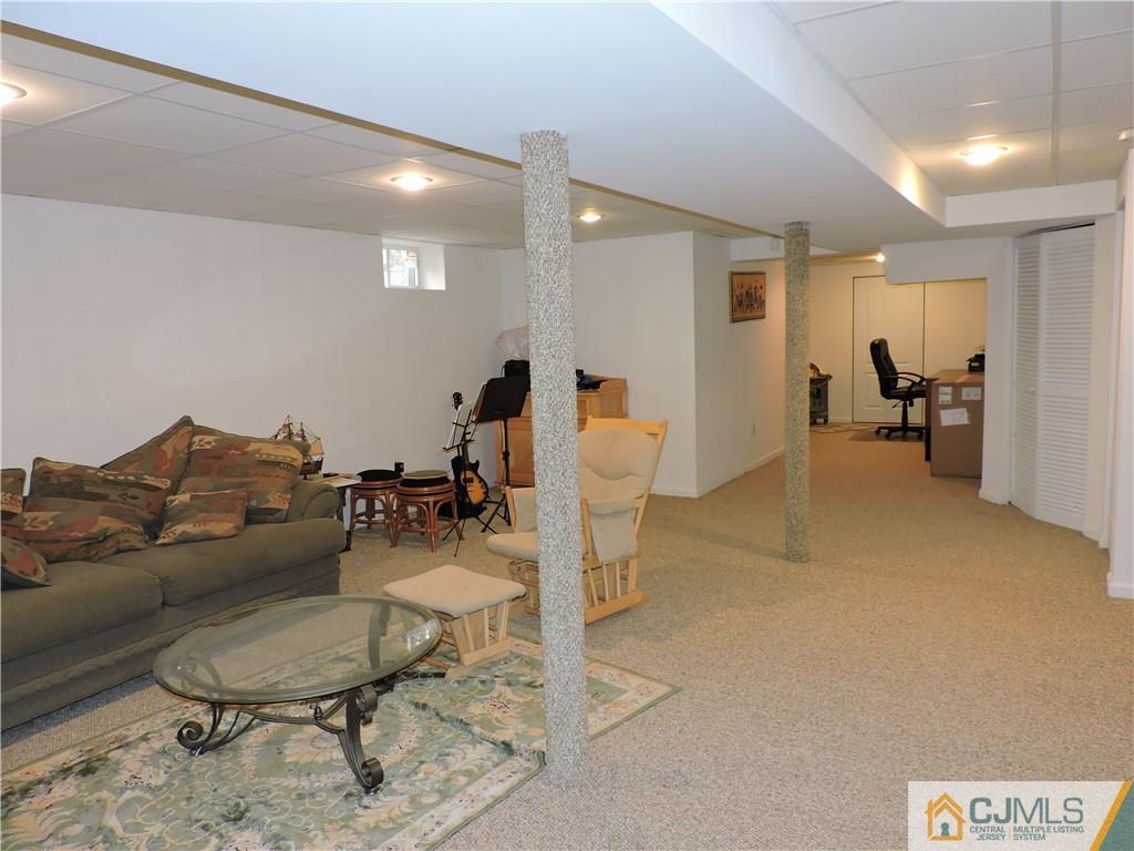236 Hawthorne Road North Brunswick, NJ 08902 - Photo 17 of 25 a living room with furniture and a wooden floor