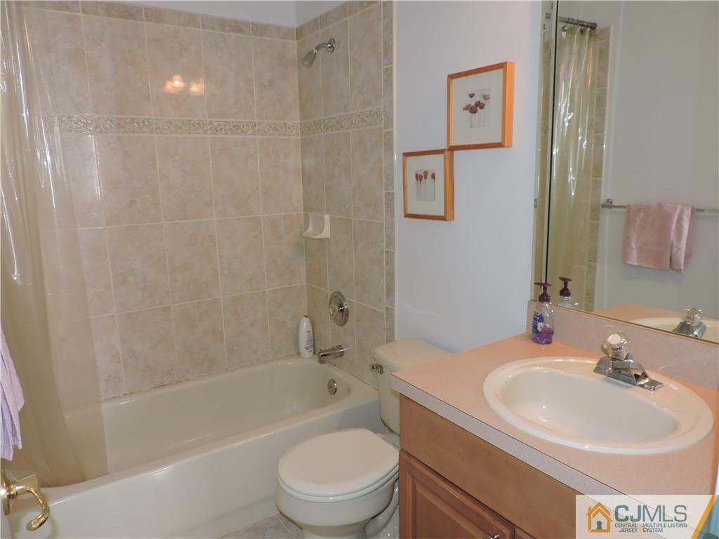 236 Hawthorne Road North Brunswick, NJ 08902 - Photo 20 of 25 a bathroom with a sink toilet and shower