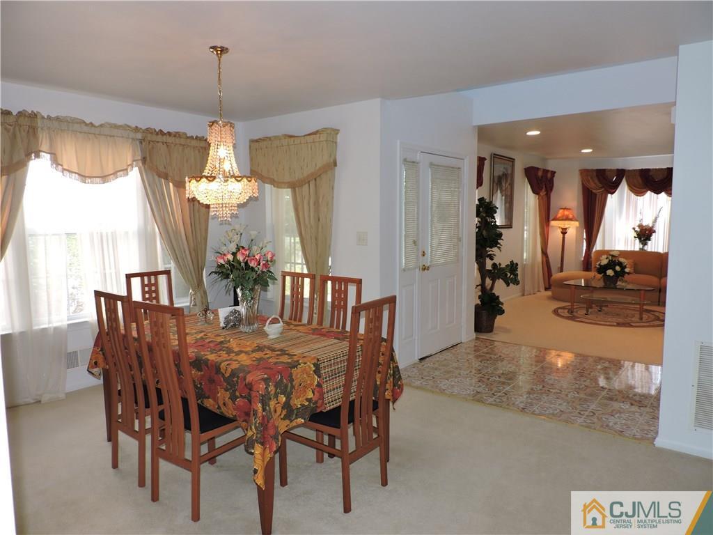 236 Hawthorne Road North Brunswick, NJ 08902 - Photo 3 of 25 a view of a dining room with furniture window and outside view