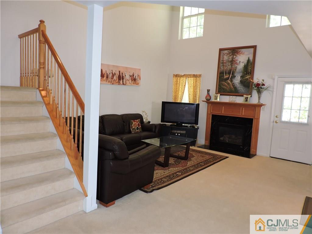 236 Hawthorne Road North Brunswick, NJ 08902 - Photo 5 of 25 a living room with furniture and a fireplace