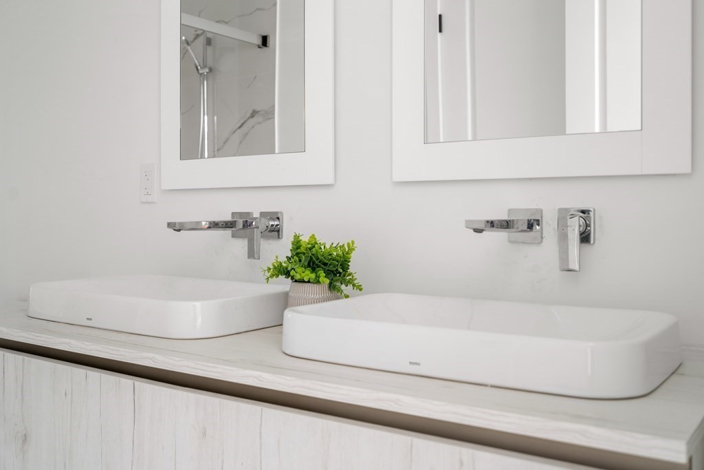 8 Leverett Street, Unit 1 Brookline, MA 02445 - Photo 20 of 29 a bathroom with a bathtub and a sink