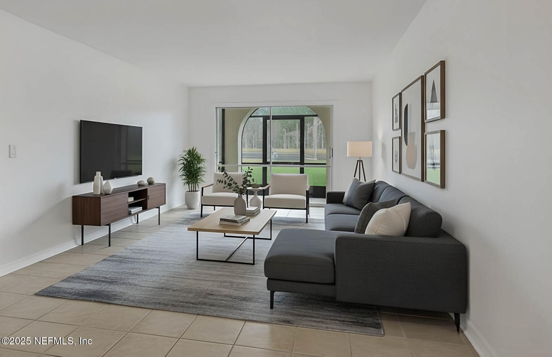 a living room with furniture and a flat screen tv
