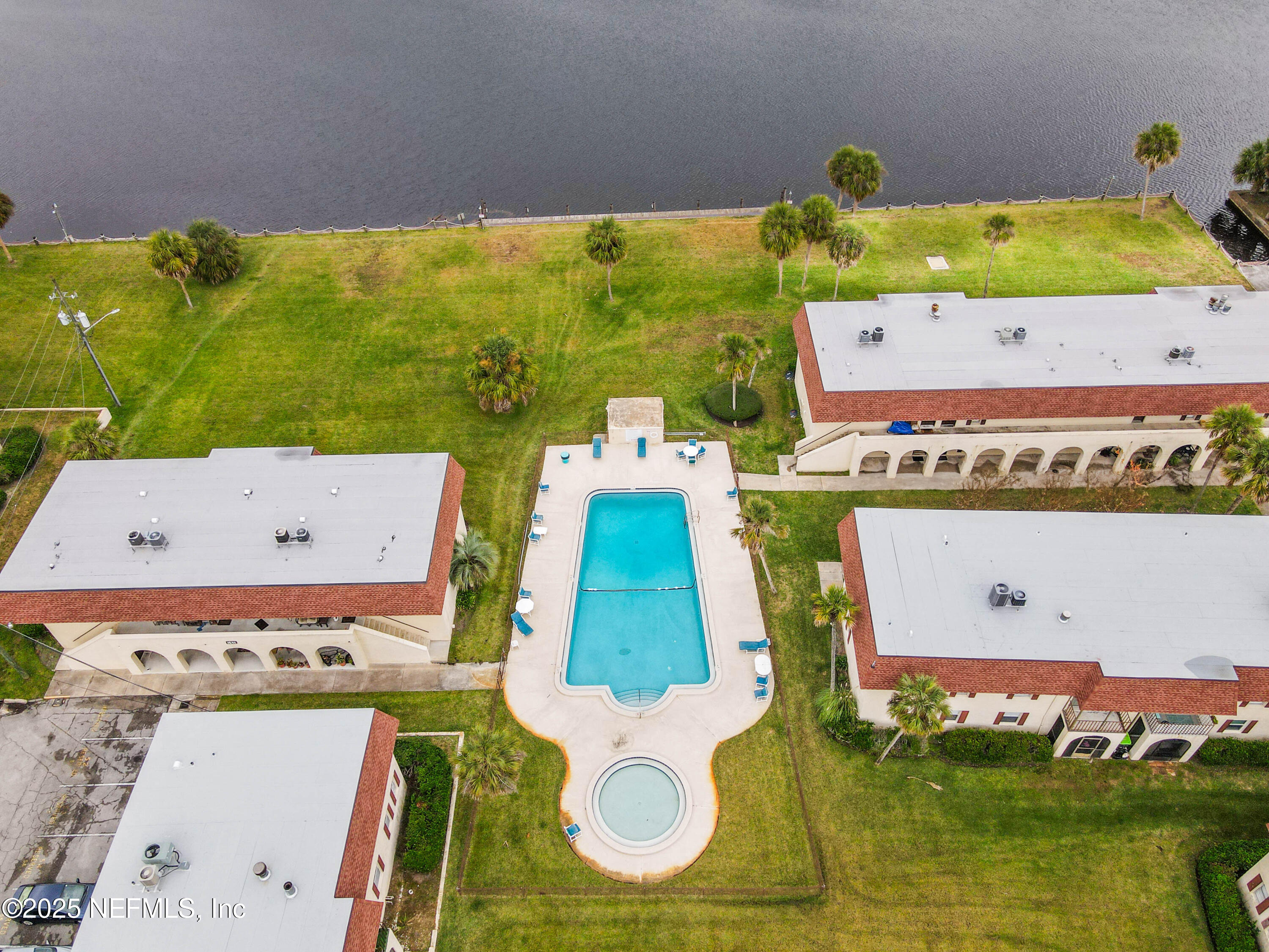 1530 El Prado Road, Unit 1 Jacksonville, FL 32216 - Photo 13 of 15 an aerial view of a pool an outdoor space and seating area