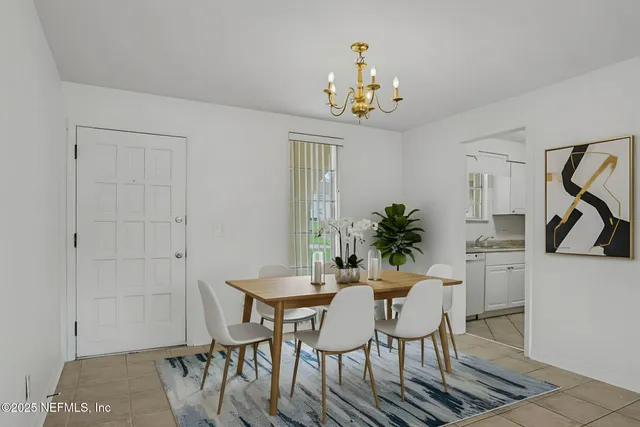 a dining room with furniture and window