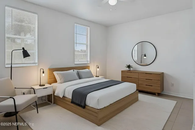 a bedroom with bed and a window