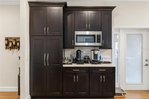 a kitchen with a refrigerator and cabinets