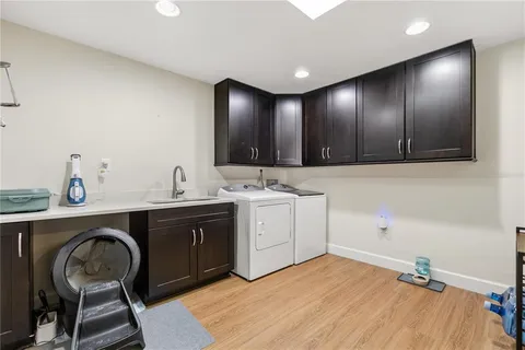 a spacious bathroom with a sink and a mirror