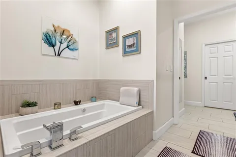 a bathroom with a bathtub and a sink