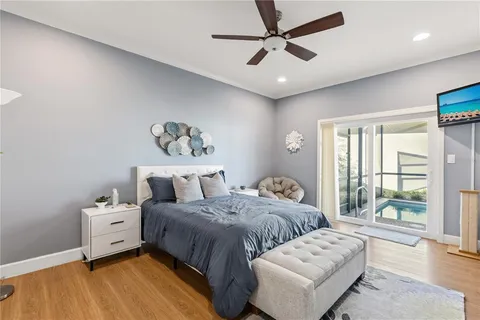 a spacious bedroom with a bed and a fireplace