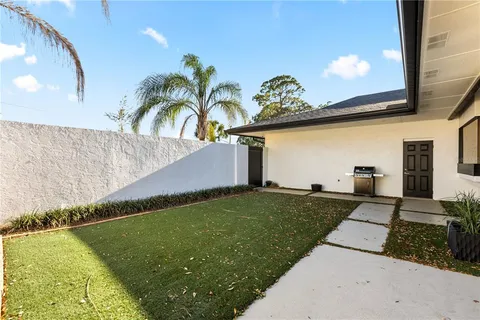 a aerial view of a house with a yard