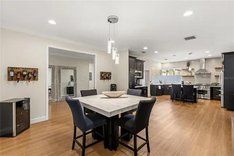 a dining room with furniture and wooden floor