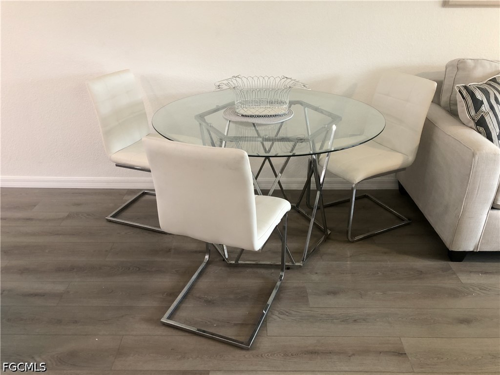 16881 Davis Road, Unit 214 Fort Myers, FL 33908 - Photo 10 of 46 a view of a room with a table and chairs