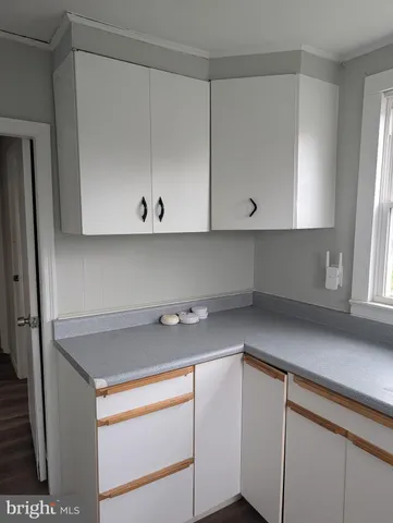 a view of cabinets and wooden floor