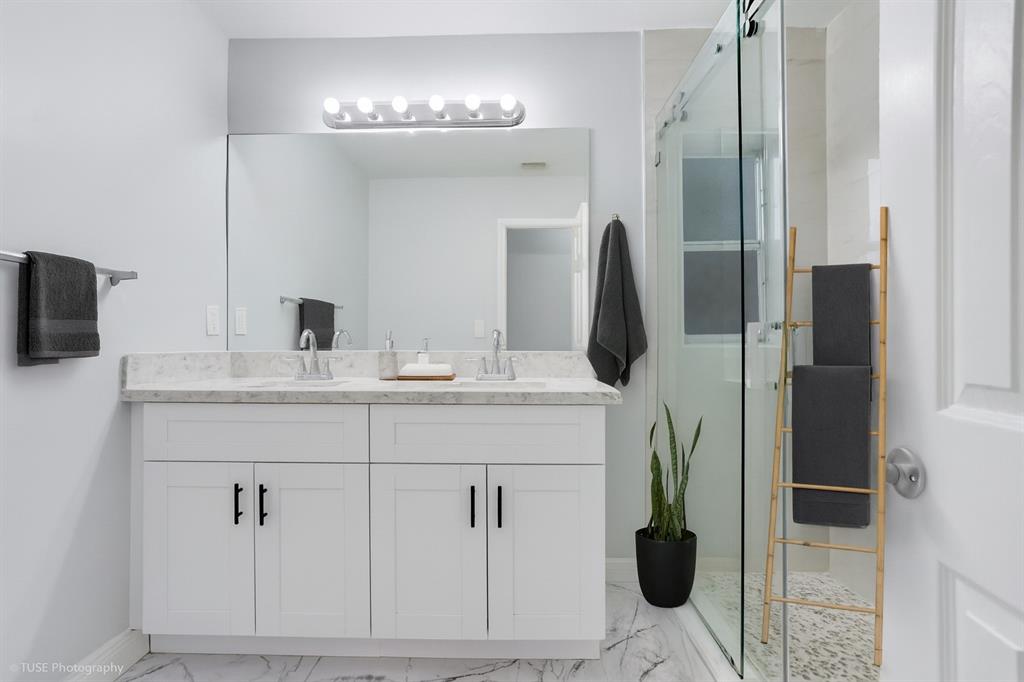 4971 Southwest 7th Court Margate, FL 33068 - Photo 11 of 15 a bathroom with a sink and mirror