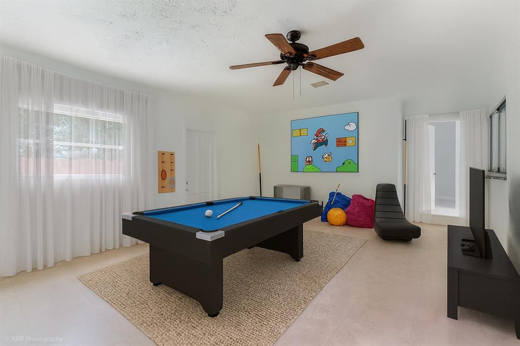 4971 Southwest 7th Court Margate, FL 33068 - Photo 12 of 15 a room with pool table and windows