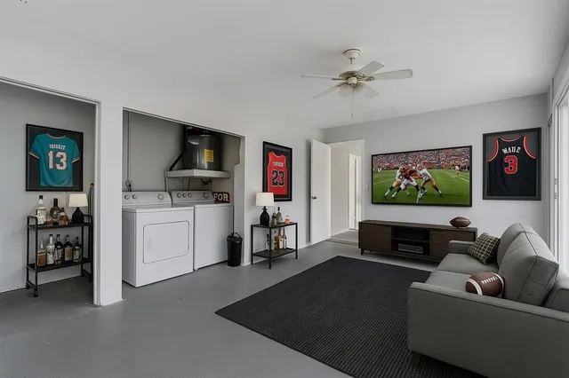 a living room with furniture and a flat screen tv
