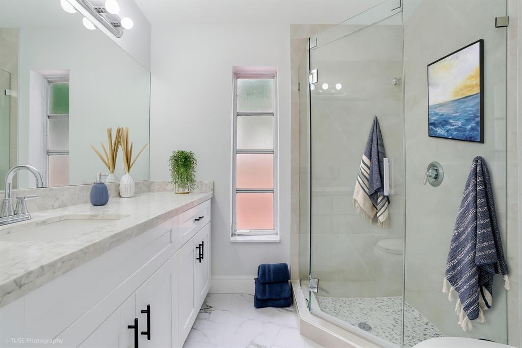4971 Southwest 7th Court Margate, FL 33068 - Photo 7 of 15 a bathroom with a double vanity sink and a mirror