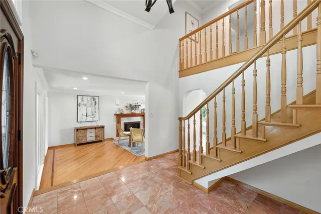 a view of a livingroom with furniture and stairs
