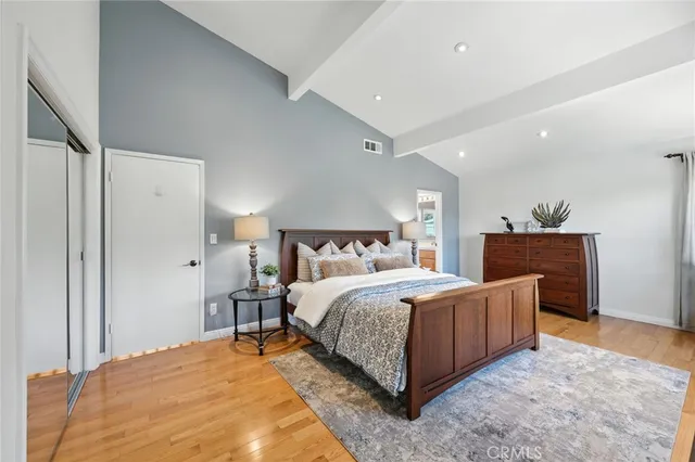 a bedroom with bed and window