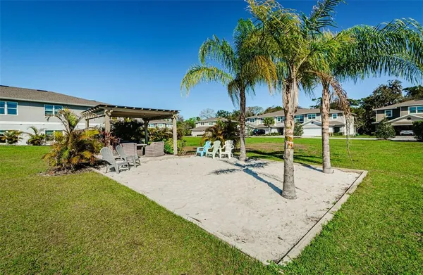 a view of a backyard with swimming pool