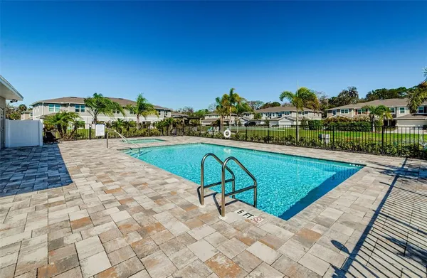 a view of a swimming pool with a lounge chairs