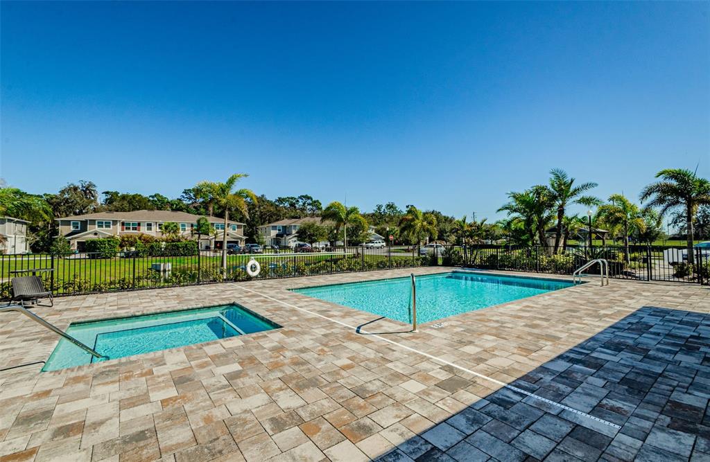 5324 Riverwalk Preserve Drive New Port Richey, FL 34653 - Photo 19 of 21 a view of a swimming pool with an outdoor seating