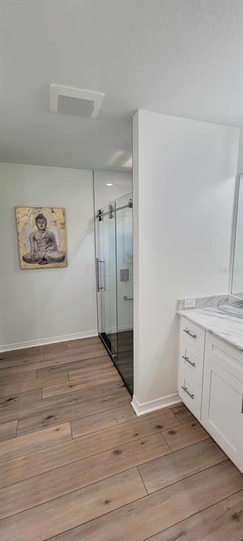5324 Riverwalk Preserve Drive New Port Richey, FL 34653 - Photo 10 of 21 an empty room with wooden floor and cabinet