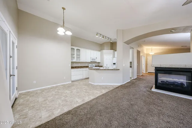 a large kitchen with cabinets and stainless steel appliances