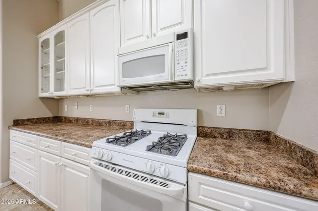 a utility room with a sink washer and dryer