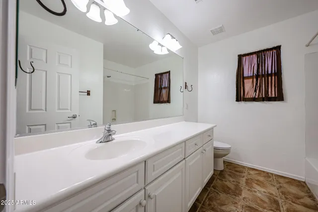 a bathroom with a bathtub and window