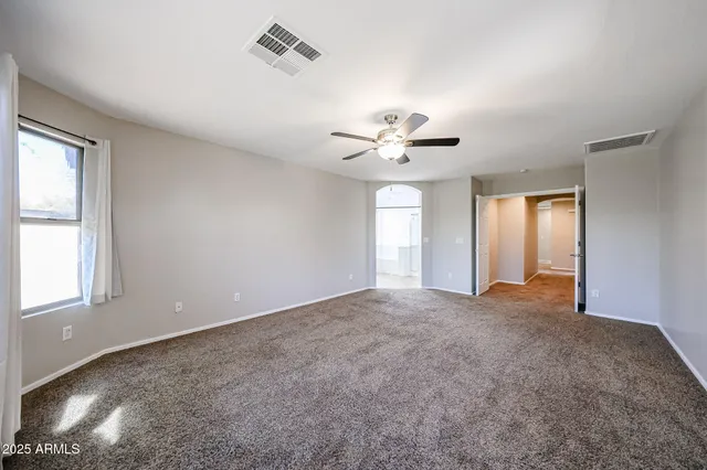 a bathroom with a double vanity sink mirror and shower