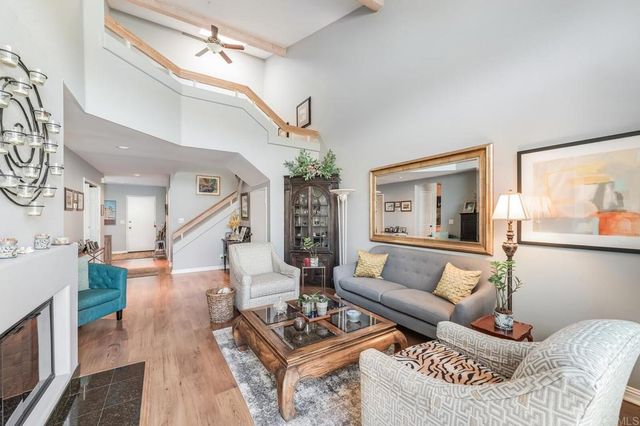 a living room with furniture and a table