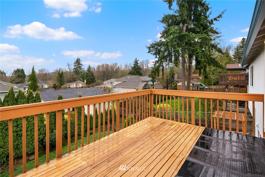 724 204th Street Southeast Bothell, WA 98012 - Photo 13 of 17 a view of wooden deck and a garden