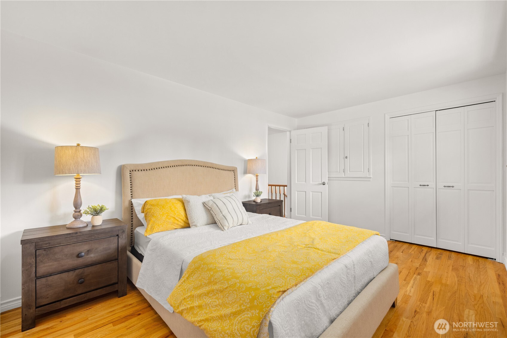 18615 81st Avenue West Edmonds, WA 98026 - Photo 15 of 37 a bedroom with a bed and wooden floor