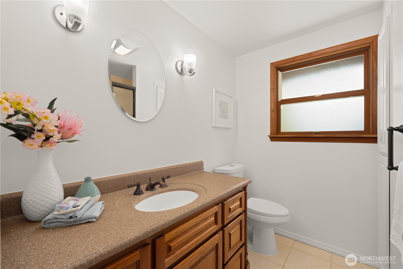 18615 81st Avenue West Edmonds, WA 98026 - Photo 19 of 37 a bathroom with a granite countertop sink and a mirror