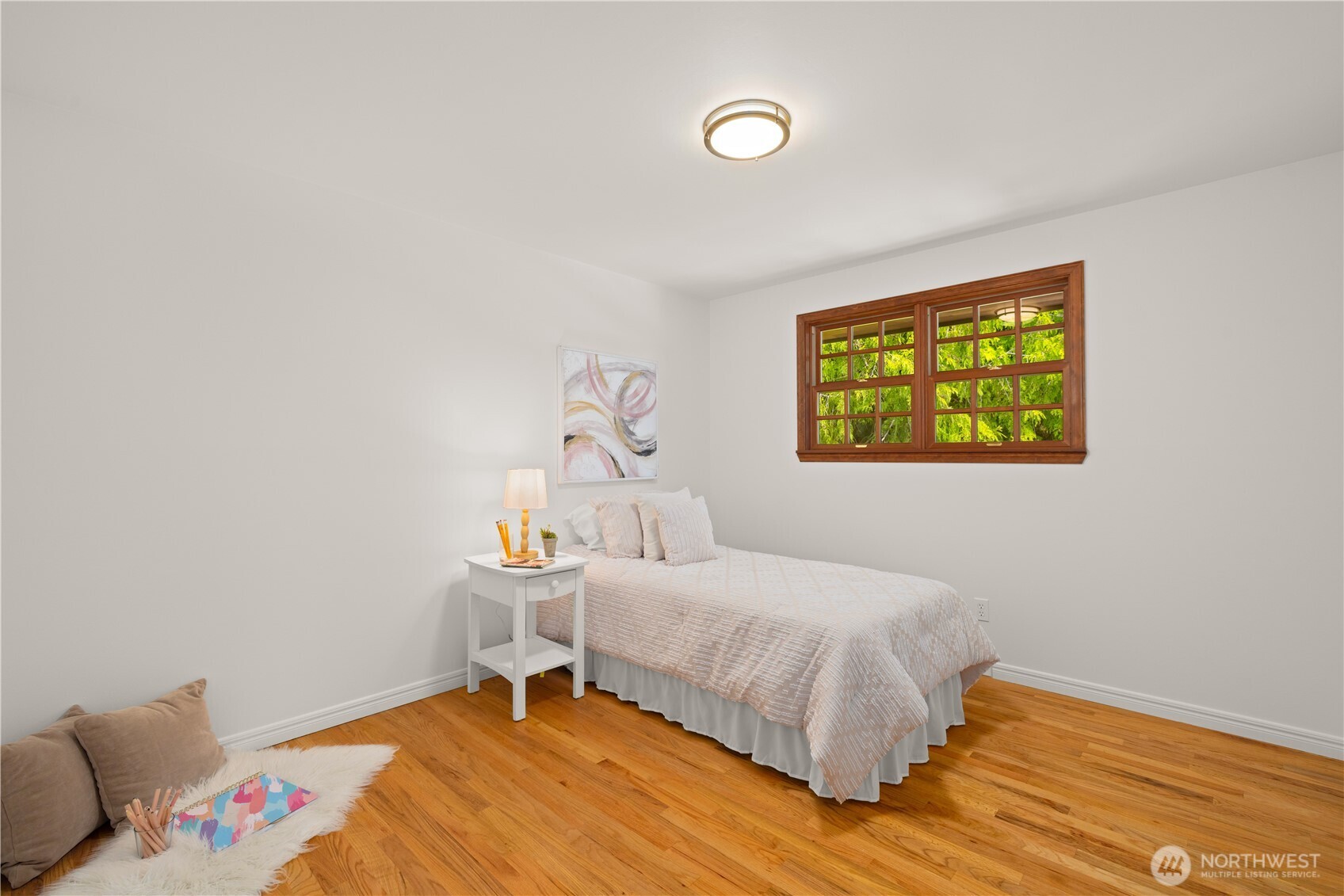 18615 81st Avenue West Edmonds, WA 98026 - Photo 20 of 37 a bedroom with a bed and a table in it