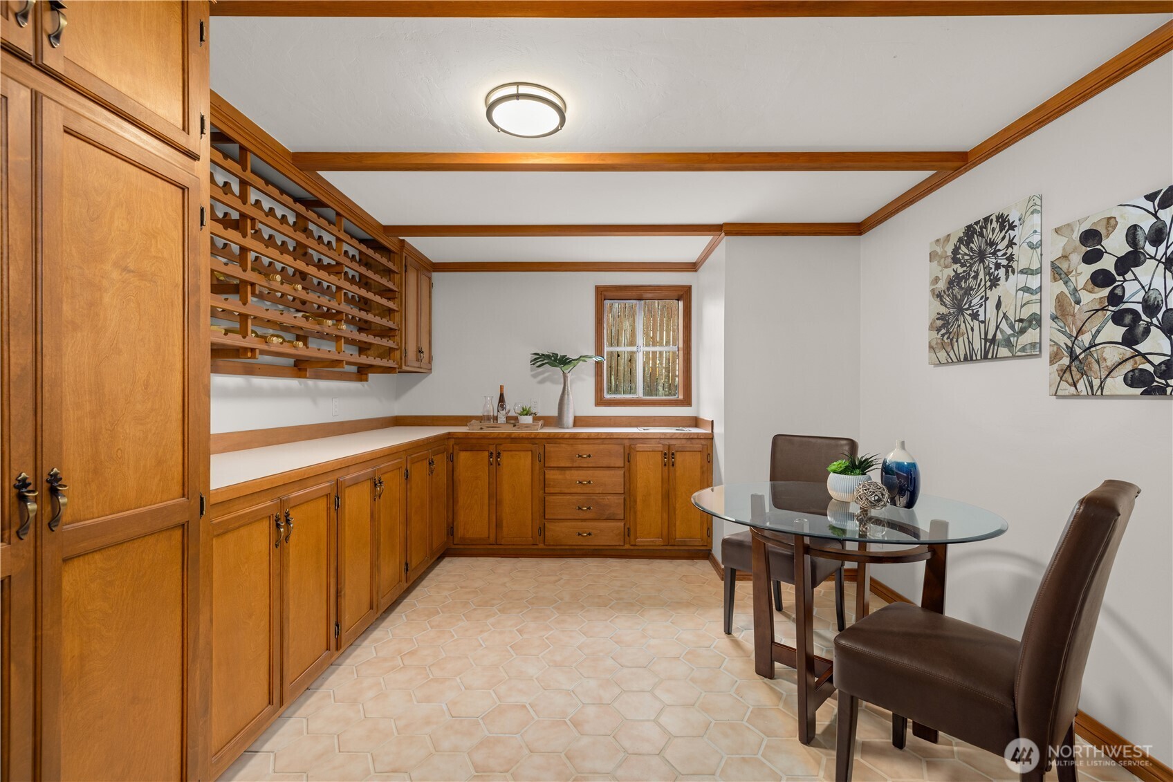 18615 81st Avenue West Edmonds, WA 98026 - Photo 23 of 37 a kitchen with a table chairs and a wooden floor