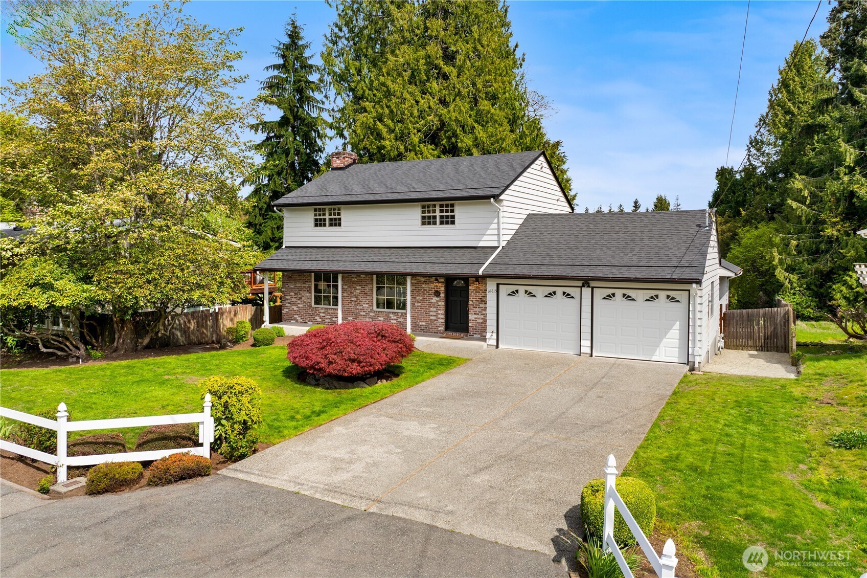 18615 81st Avenue West Edmonds, WA 98026 - Photo 33 of 37 a front view of a house with a yard and garage