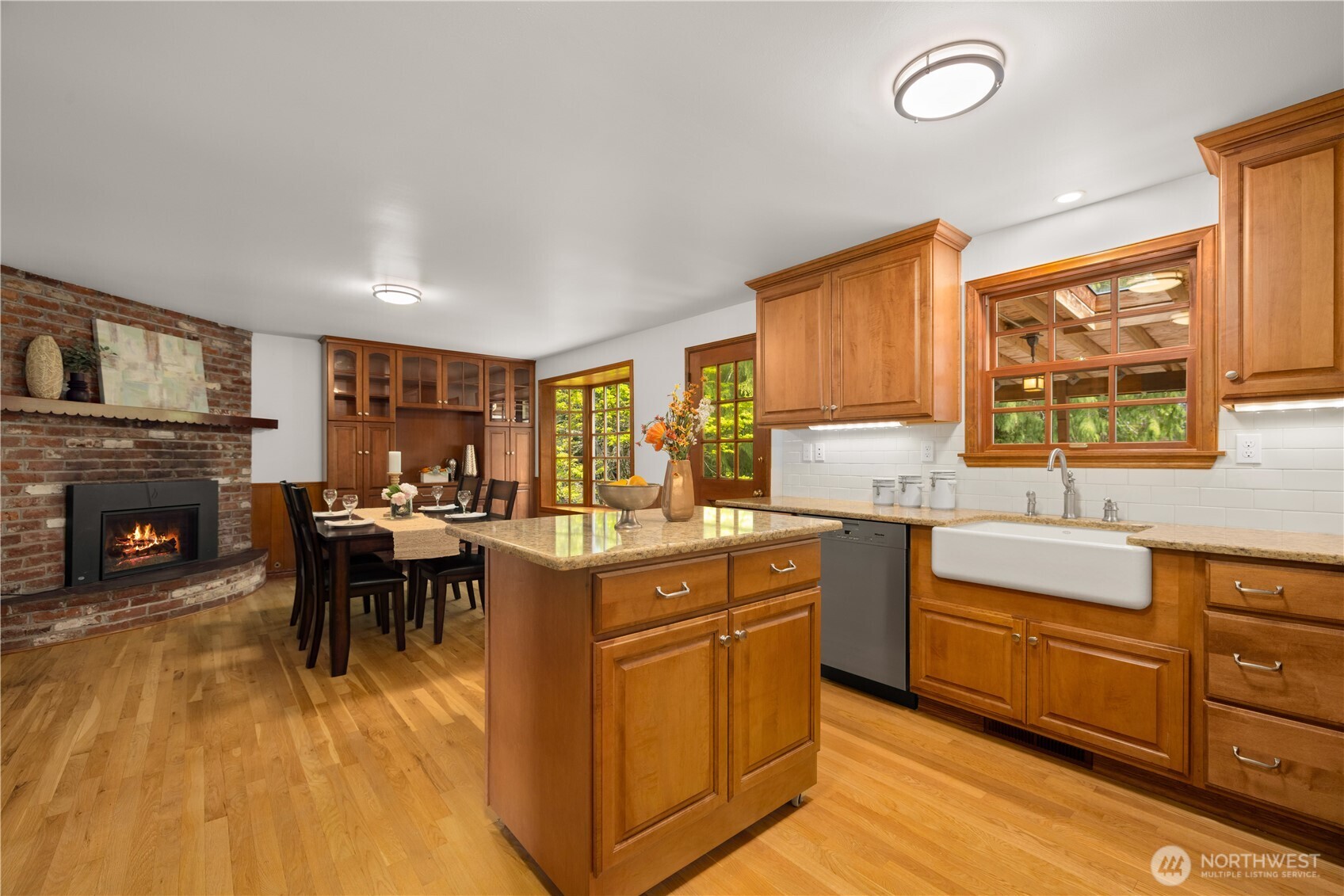 18615 81st Avenue West Edmonds, WA 98026 - Photo 7 of 37 a kitchen with sink cabinets and dining table