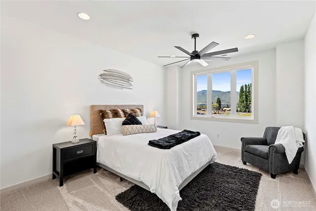 a bedroom with bed and a window